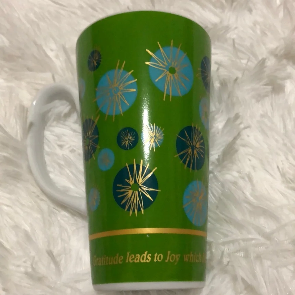 Green Fireworks coffee mug by Julia Minasian